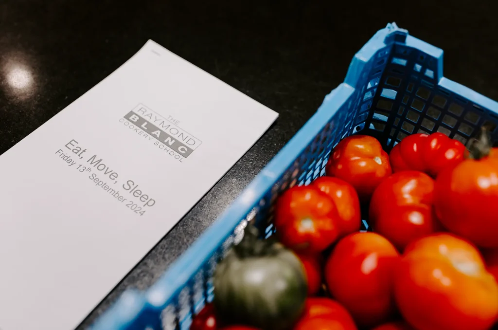 tomattos in a basked with a paper next to it