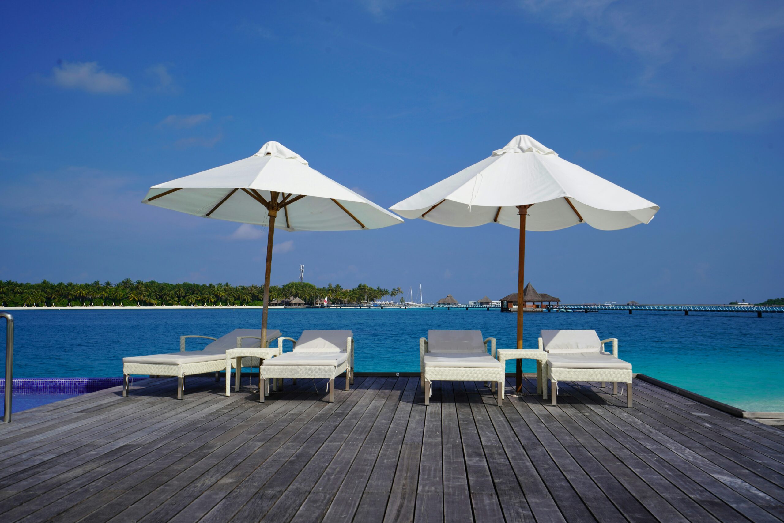 Sunbed and sunumbrella on a deck